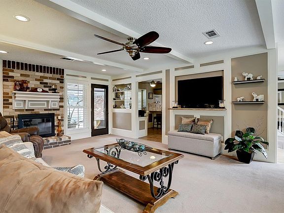 Living area with views of breakfast area and access to patio area. The living room has great views of the pool from the large windows.