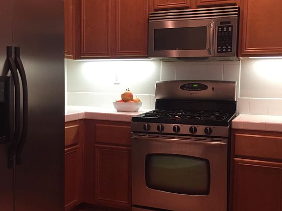 Fridge, microwave, and stove are all included