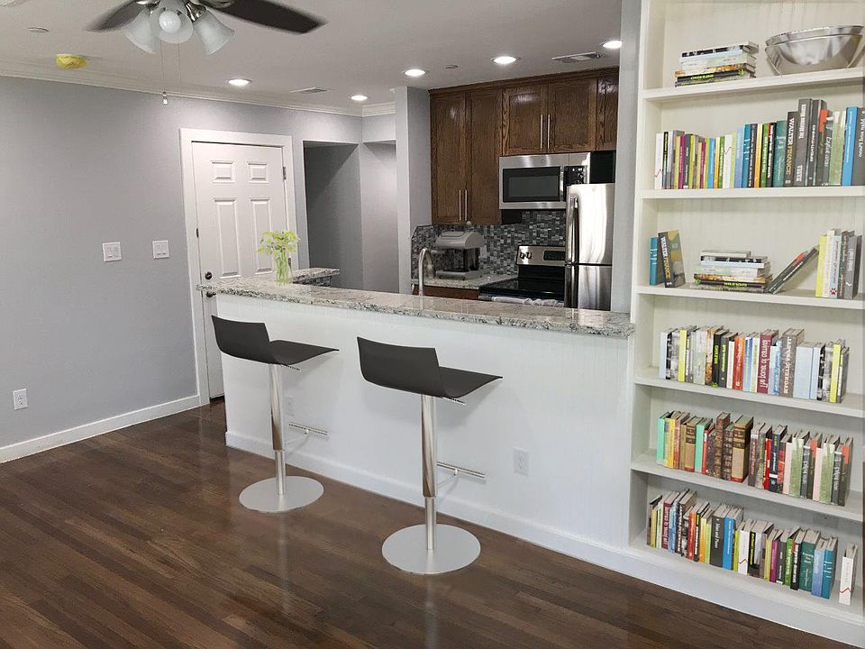 Bar top overlooking the Kitchen. Built in bookcase for your library or decorative collectibles.