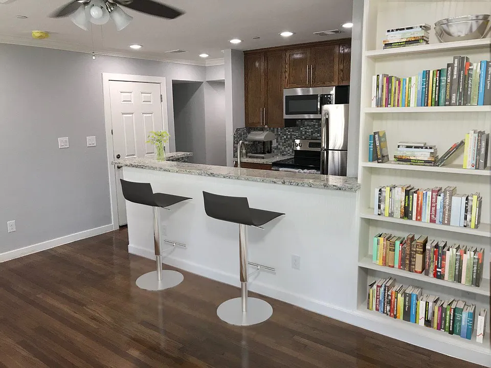 Bar top overlooking the Kitchen. Built in bookcase for your library or decorative collectibles.
