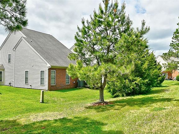 Backyard backs up to golf course land. 