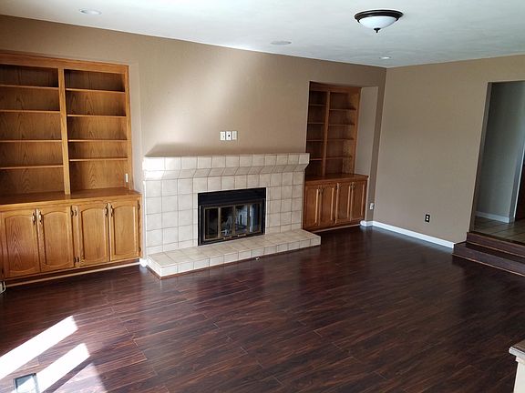 Living Room built in cabinets TV connections above fireplace