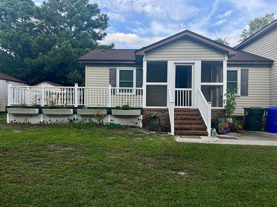 Front of house with porch and deck