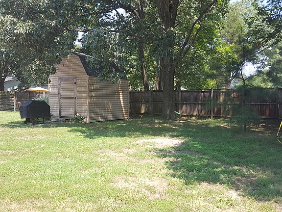 Large fenced yard and shed