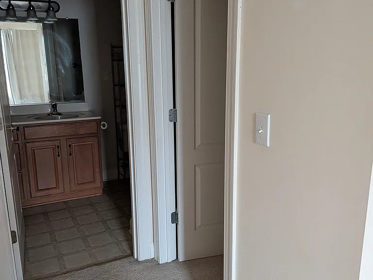 into bathroom and closet off bedroom #1