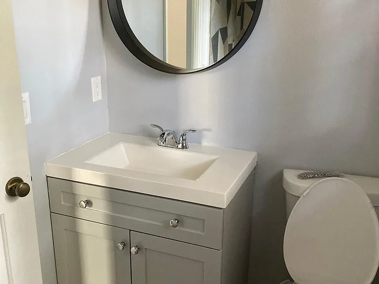 Primary bathroom has a new vanity and tile bath tub enclosure.(not seen)