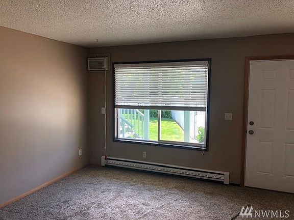 Living room with large windows providing natural light and views