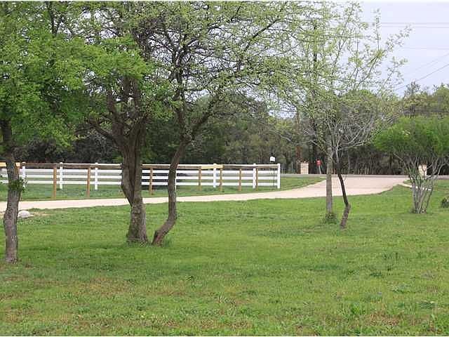 Long Finished Driveway with Nice Small to Medium Sized Trees