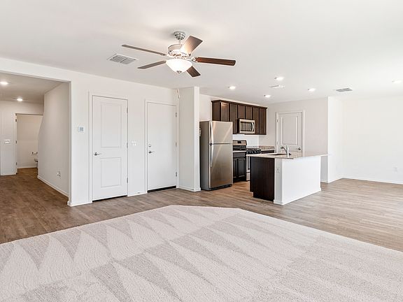 The kitchen overlooks the family room, ensuring you never miss out.