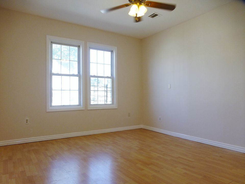 Living Room With Wood Floor & New Ceiling Fan