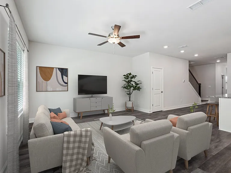 Living room with large window letting in a ton of natural light.