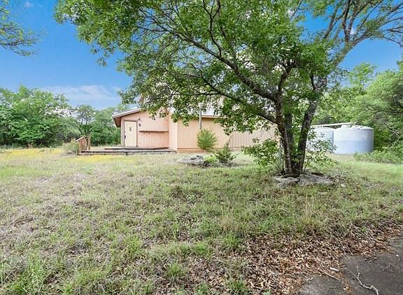 The front view of the home.  You can see the rain collection systems in the rear of the home.  Catch the rainwater, filter it and then it can be used.  Save money on water.
