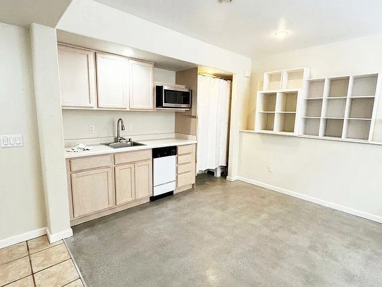 Garden level second master suite with private entry, kitchenette and full bathroom. Can be used as office, guest bedroom, yoga studio, etc.