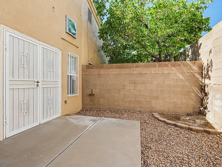 Backyard with direct access to primary bedroom.