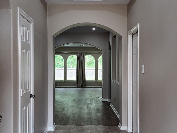 Front door entry way to a large open living room.