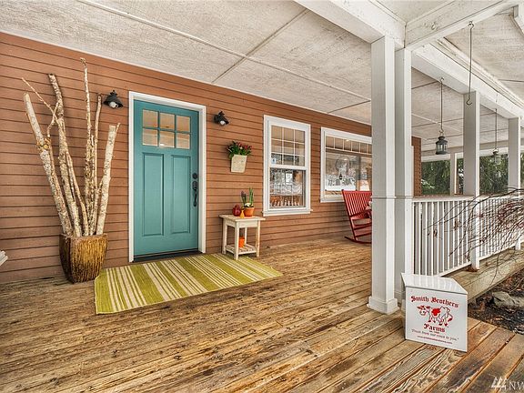 Wrap around covered deck to the back yard over looking 1.25 acre of privacy!