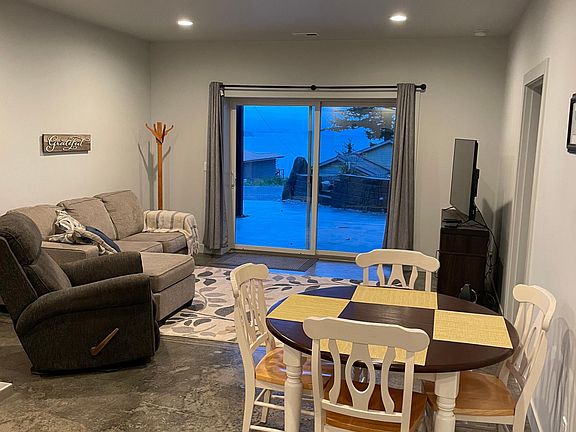 Living and dining with ocean view, electric fireplace and tv