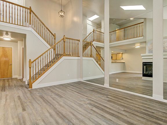 Floor-to-ceiling mirrors bring in light and a feeling of openness.