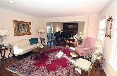 Living Room opens to Music Room with Fireplace