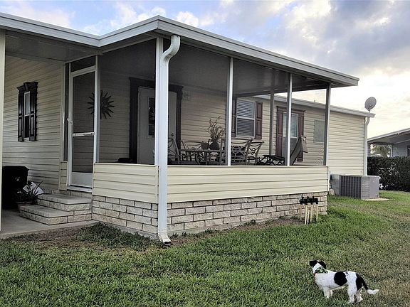 door to carport and storage shed