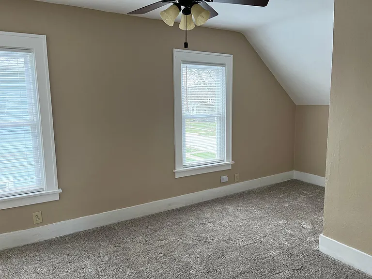 Main bedroom with new carpet and paint.