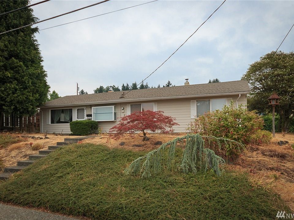Welcome Home to this one-story view home conveniently located on a corner lot in East Bremerton!  This one is move-in ready with 2 bedrooms and 1.5 bath, living room with a large picture window looking out at the Olympics, a wood fireplace and a slider to the back patio, galley kitchen with a garden window, dining room, cement planked siding, shed in backyard for more storage, AND a private driveway for easy parking.  Come see this HOME TODAY!
