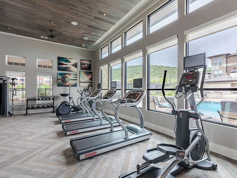 Fitness Center With Treadmills, Elliptical Machines, And Weight Rack