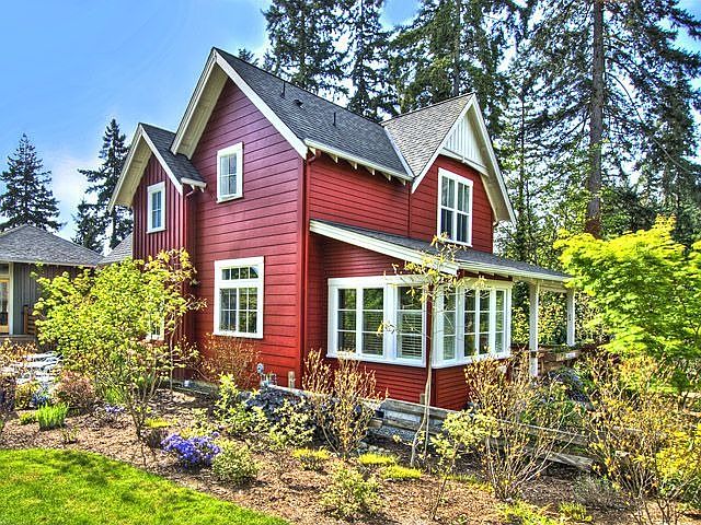 Cottage Living at its best. Lush landscaped yards with colorful gardens. Front porch and private fen