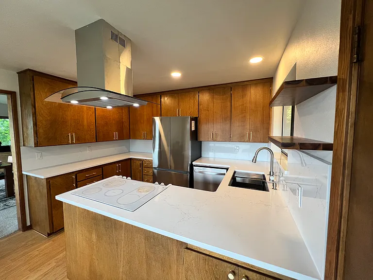 New Fridge, under mount sink and overhead vent fan.
