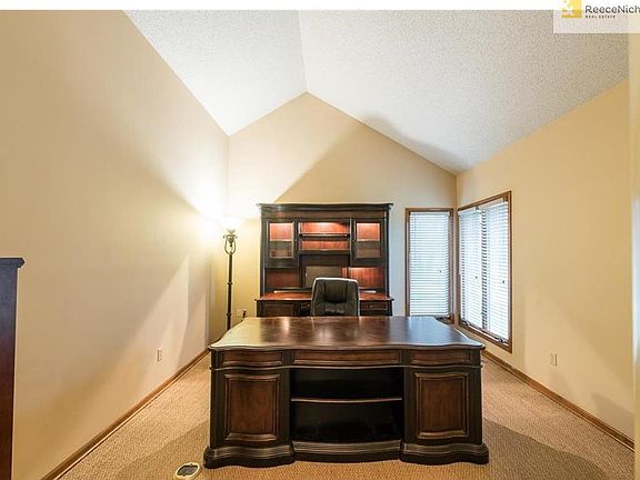 Stately office with views of the front yard water feature.