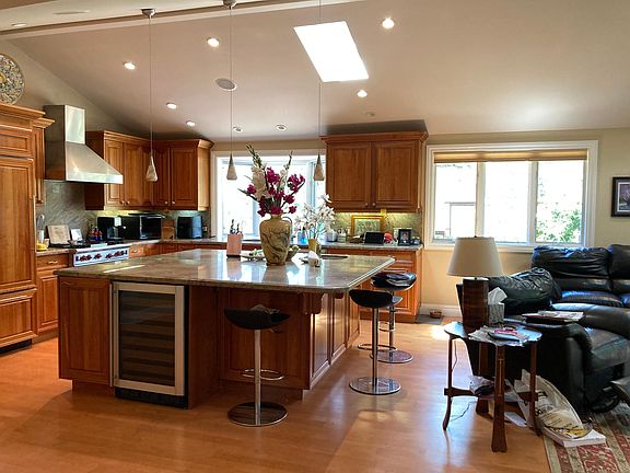 Subzero Refrigerator to the left, wine cooler under island, 4 bar stools from Italy..