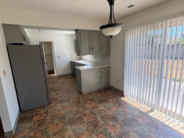 Dining area with sliding glass door to backyard