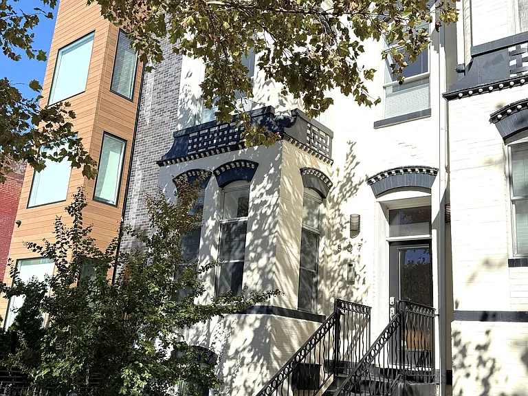 Originally a large 4 level circa 1900 Georgian style townhome, this is now 5 luxe condos facing a shared back garden.