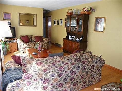 Living room and you stand in entry area.