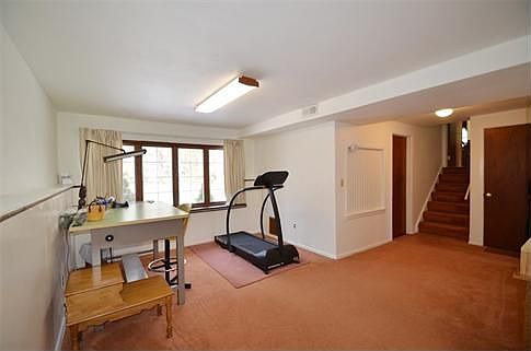 Ground Level Family Room Overlooking Picturesque Rear Yard