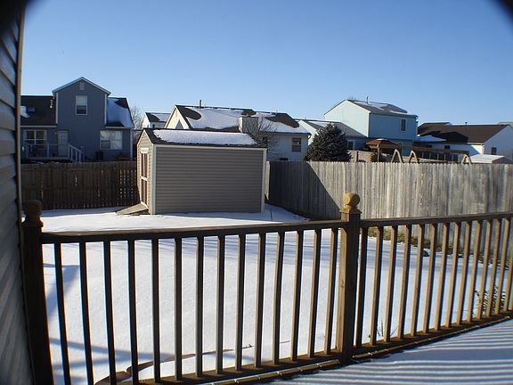 Fenced yard, deck and storage shed.
