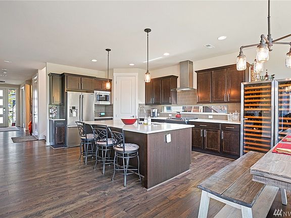 Large open living space with kitchen, family room and dining room.  There is a office to the left of the front door as you enter (not pictured) all on the main floor.  Also, a main floor bedroom, 3/4 bath, mudroom.  SimpliSafe security alarm (owned, no lease) Arlo Pro wireless camera system for monitoring all door entryways via smart device.