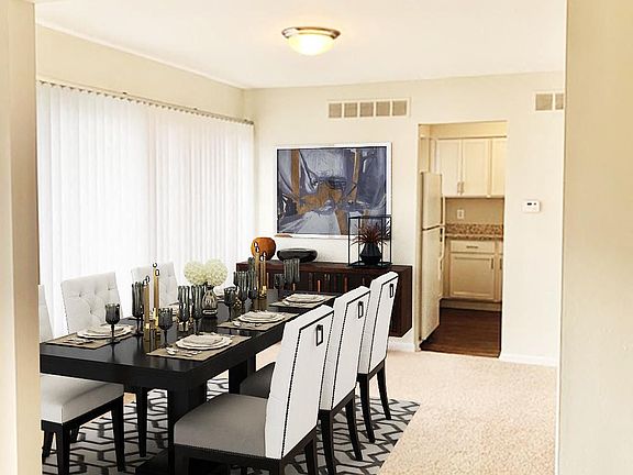 Formal dining room in large townhome with upgraded, updated interior.