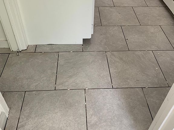 New tile floor in kitchen. Wood floors in living room