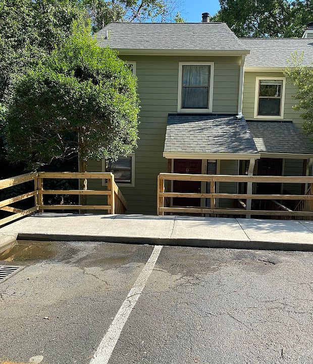 townhouse front view with parking space to the left