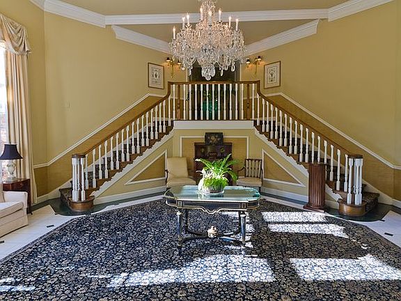 ENTRY FOYER IS IMPRESSIVIE WITH BEAUTIFUL CHRYSTAL CHANDELIER
