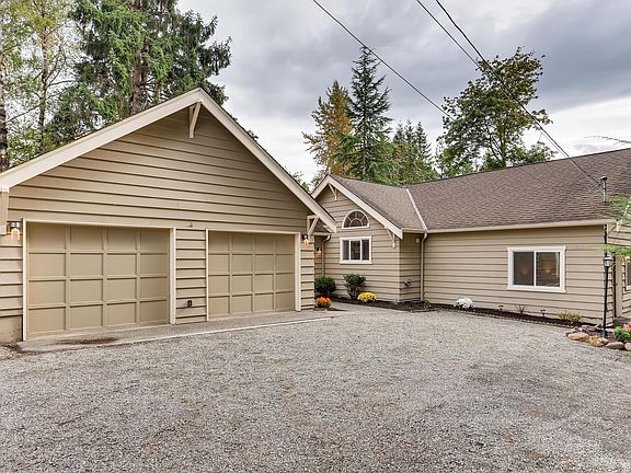 Exterior photo of the home. Decent size driveway to park your cars and a oversize garage to park inside.