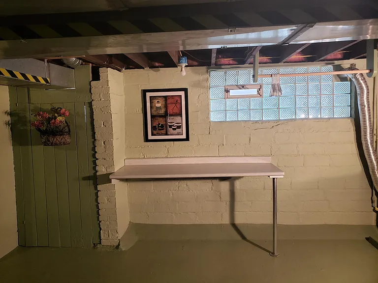 Laundry folding table for your use along with clothes hanging station.