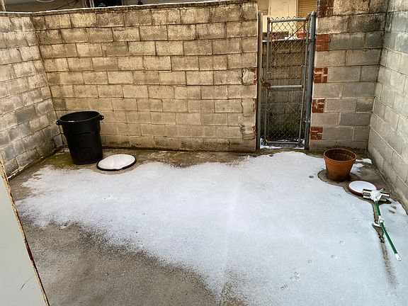 Large rear yard fully concrete