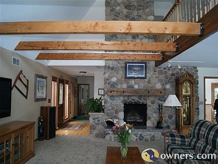 Living room with beautiful natural stone fireplace