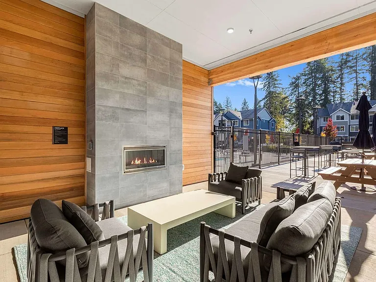 Enjoy cozy Lacey evenings at our covered outdoor patio featuring a built-in fireplace and heater.