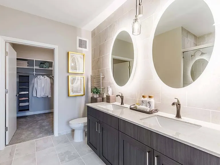 Upgraded fixtures continue into the bathrooms including dual vanities, heated towel warmers and backlit bathroom mirrors*