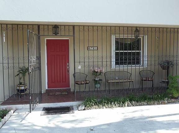Entrance with gated porch