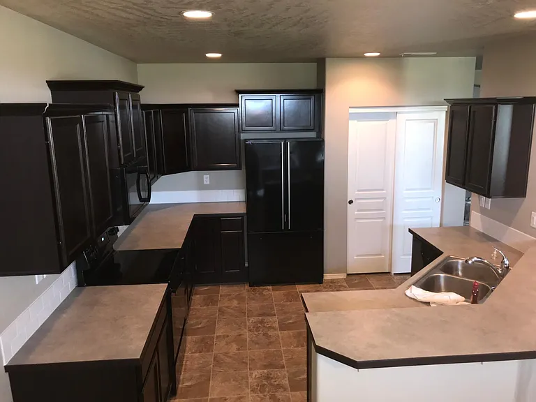Lots of kitchen cabinets and a closet pantry