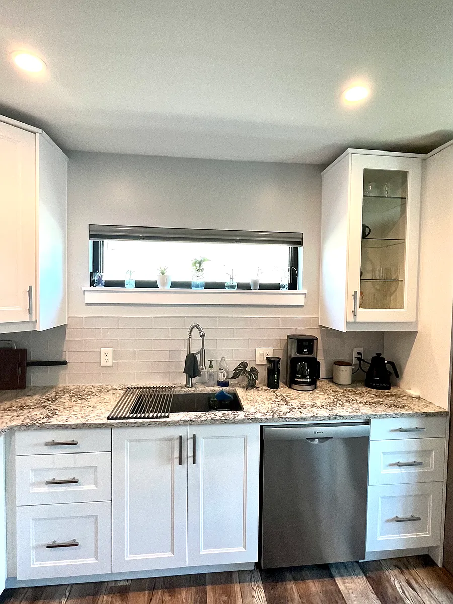 Quartz countertops, in cabinet, and under cabinet lighting for a distinct ambiance. - 1468 N Osceola St #B
